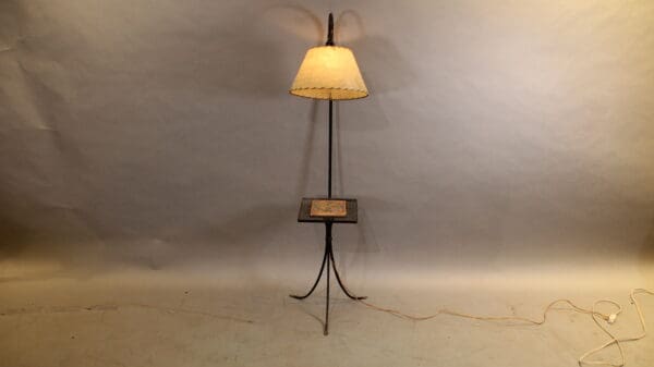 Vintage floor lamp with a small table.