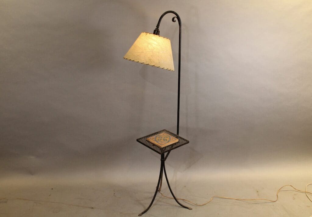 Ornate floor lamp with integrated small table.