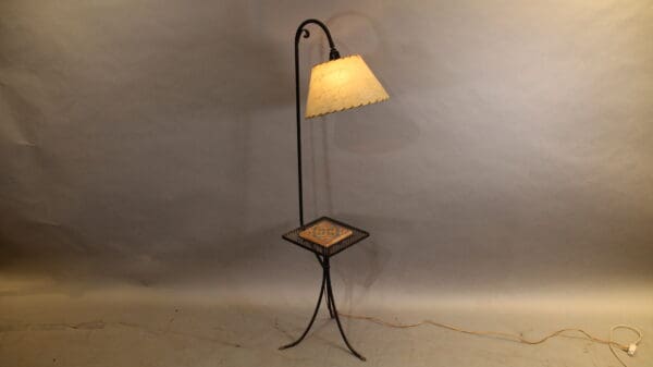 Vintage floor lamp with decorative table.