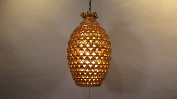 Golden textured hanging pendant light fixture.