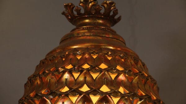 Ornate golden lamp with intricate patterns.