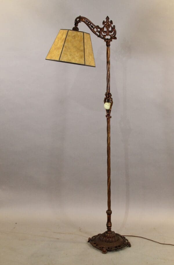Vintage floor lamp with ornate design.