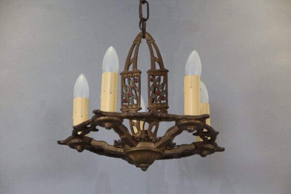 Vintage chandelier with candle-shaped bulbs.