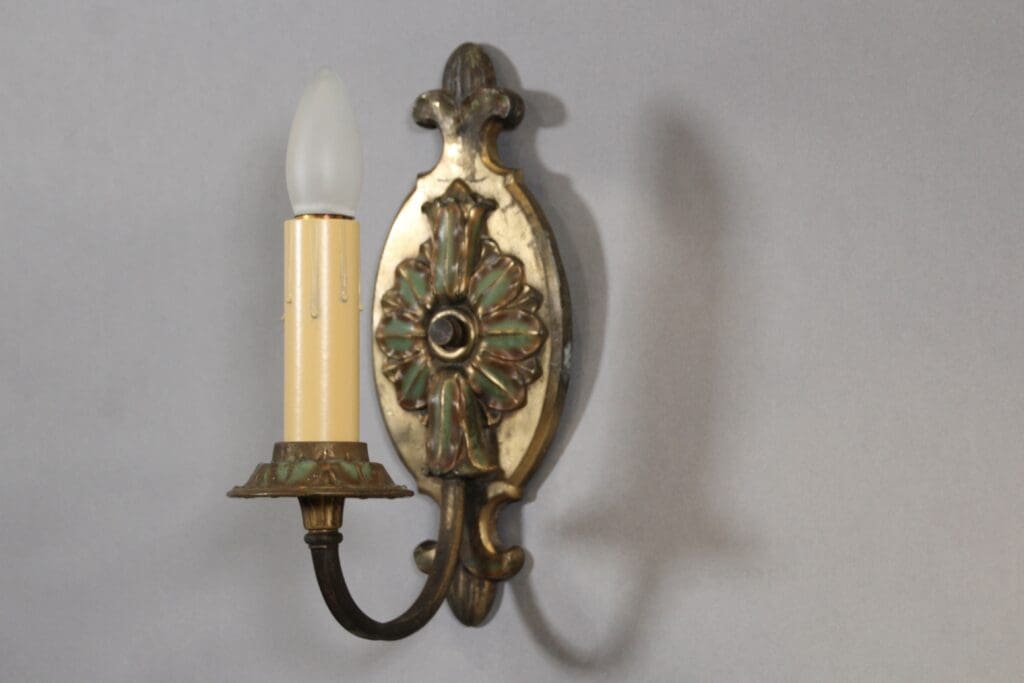 Vintage brass wall sconce with bulb.