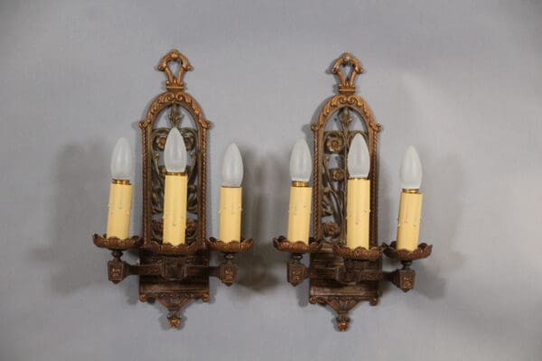 Vintage wall sconces with candle-shaped bulbs.