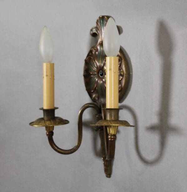 Antique double wall sconce with bulbs.