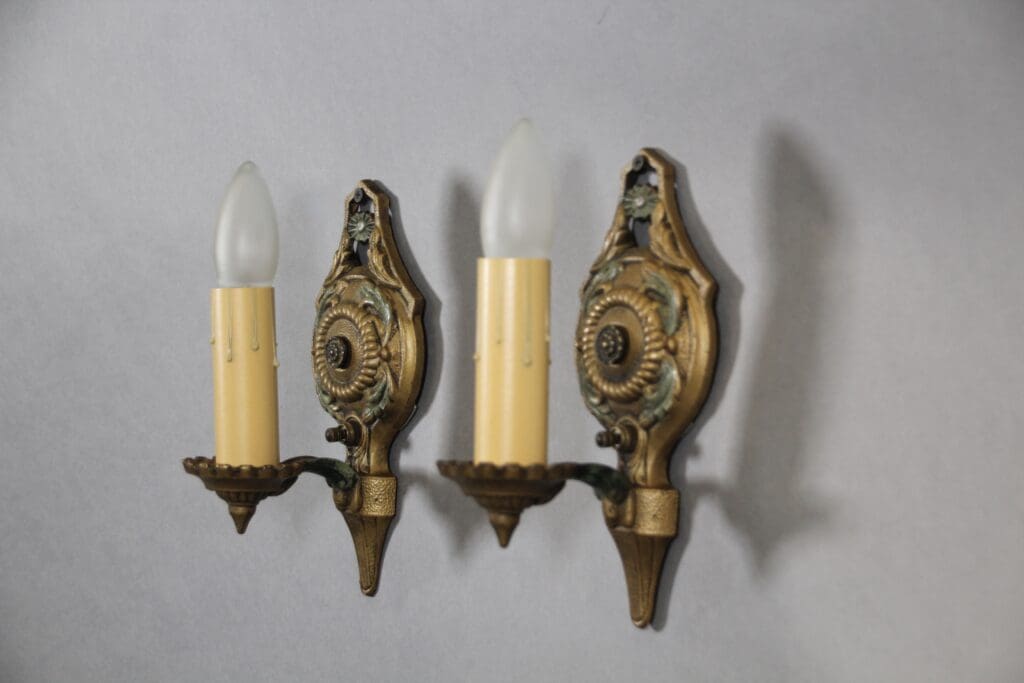 Vintage brass wall sconces with bulbs.