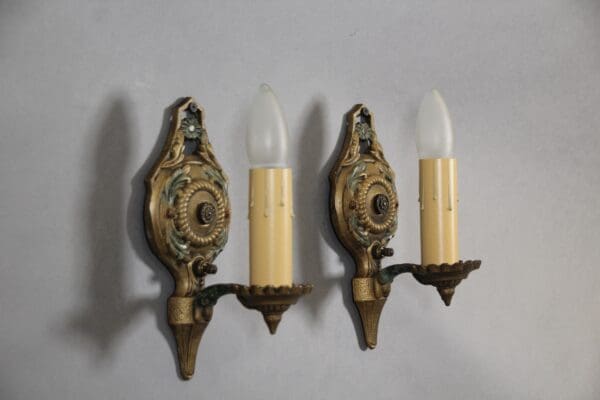 Vintage wall sconces with candle-shaped bulbs.