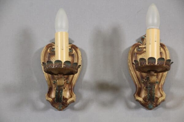 Vintage wall sconces with candle-shaped bulbs.