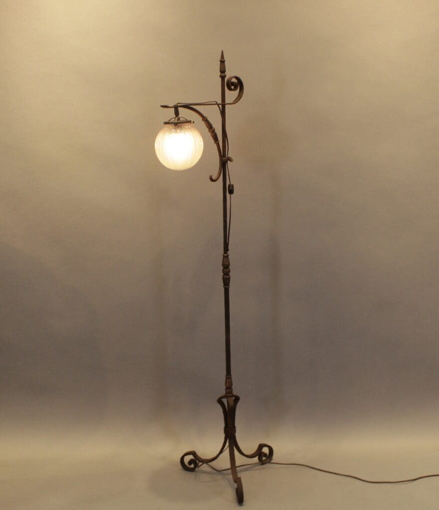 Ornate vintage floor lamp with globe shade