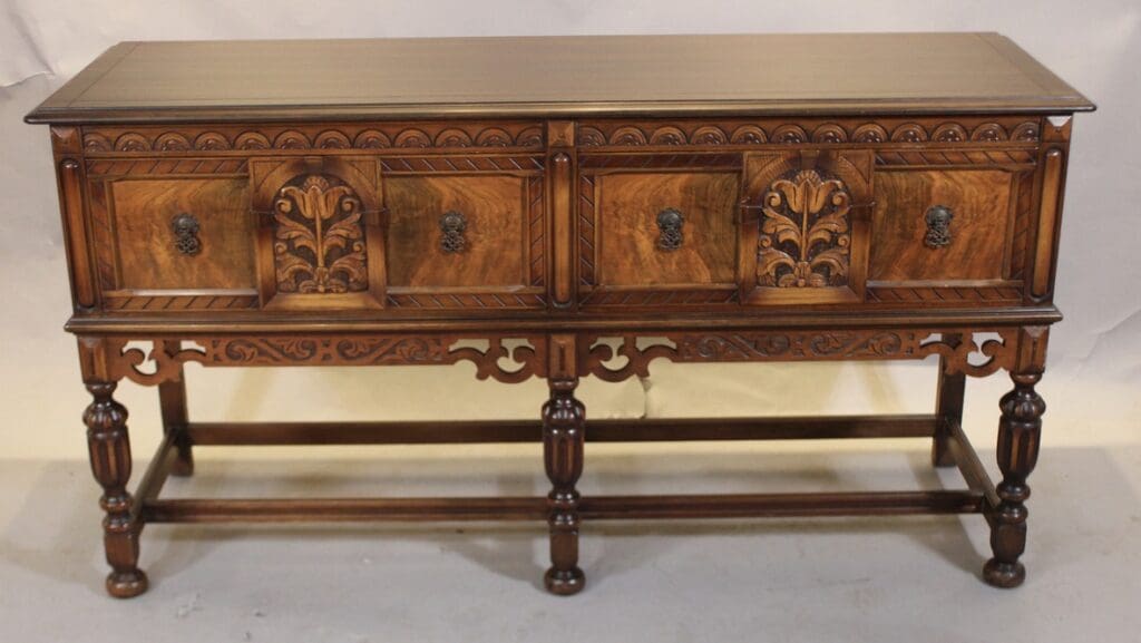 Antique carved wooden sideboard with turned legs