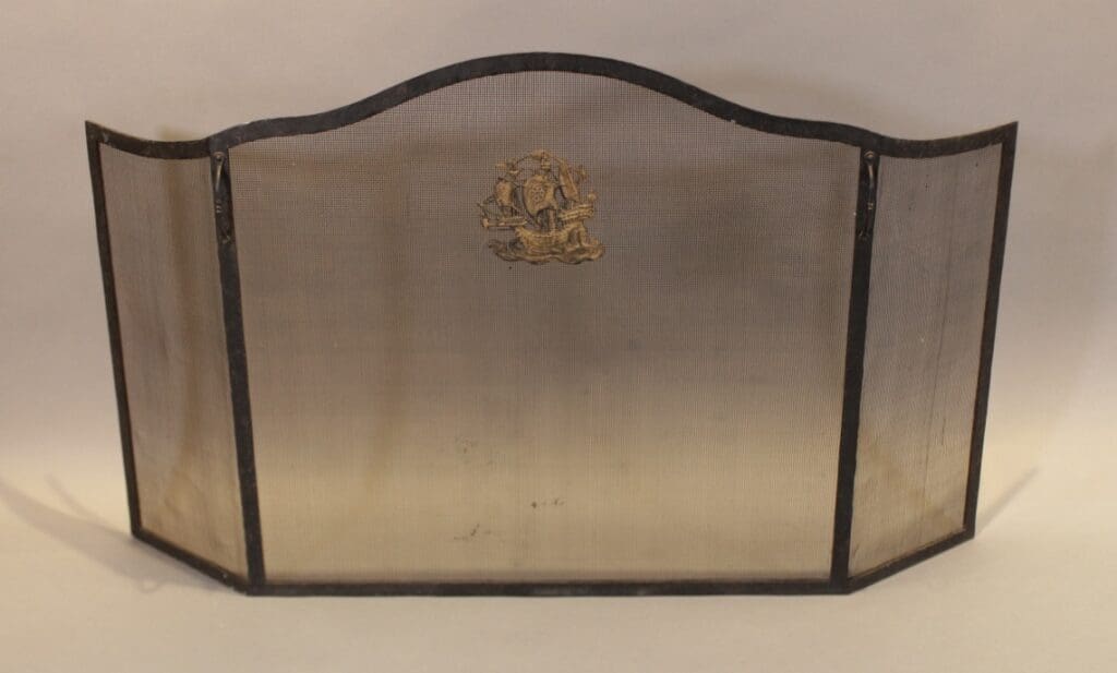 Three-panel metal fireplace screen with crest
